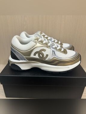 CHANEL White and Metallic Gold Logo Low-Top Sneakers